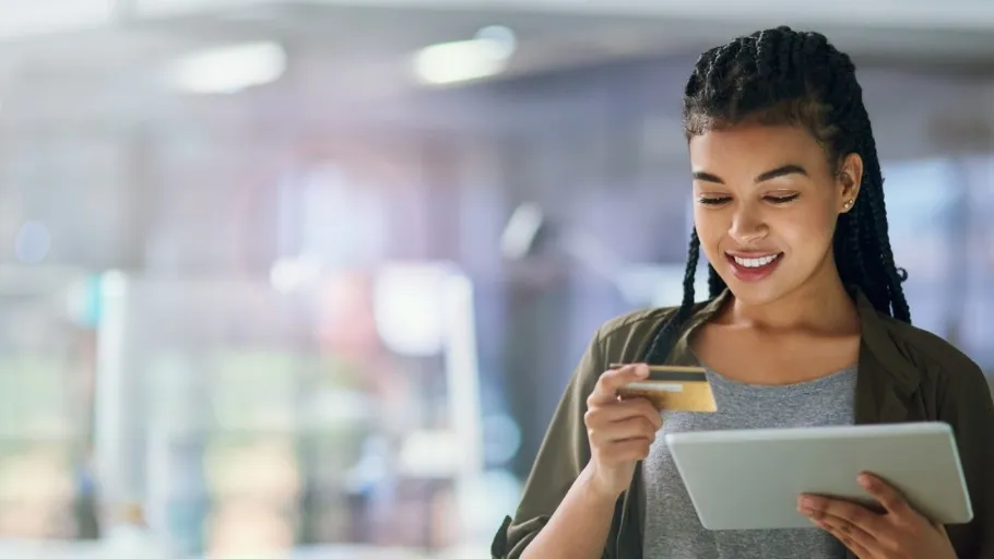 An employee using a credit card for expense management