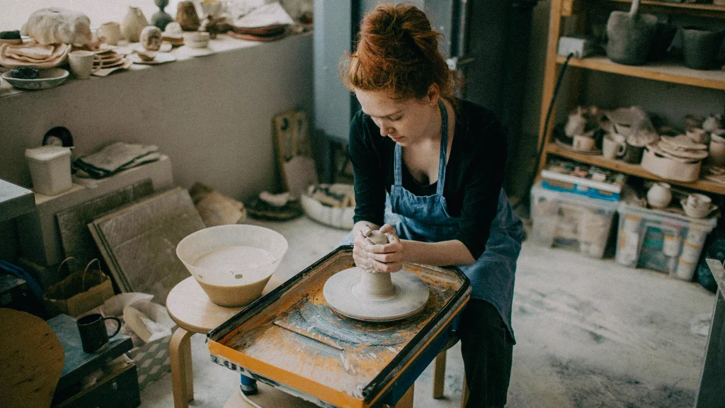 Small business pottery studio manages debt utilization